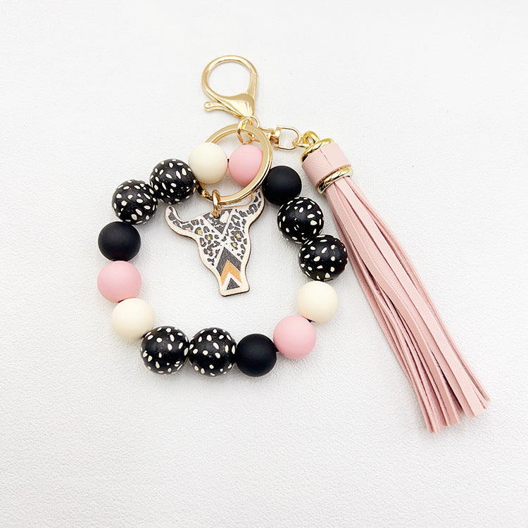 Wholesale Wooden Ox Head Sesame Spotted Wooden Beads PU Tassel Wrist Keychain